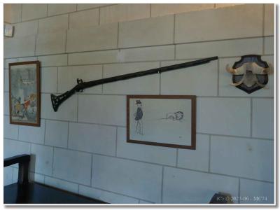 Gravure de chasse et fusil.